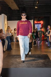 Faris Maloff, psychology student from Nova Southeastern University, in the fashion show for mental health -inspired apparel Faris Maloff, psychology student from Nova Southeastern University, in the fashion show for mental health -inspired apparel