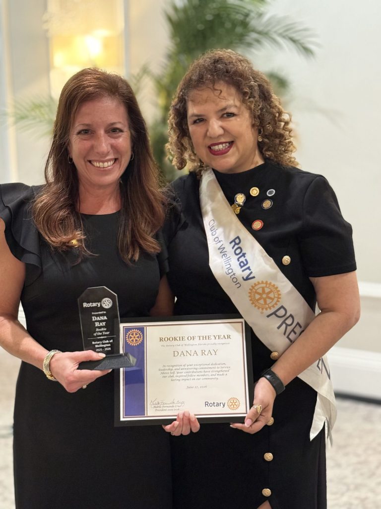 Dana Ray receiving the Rookie of the Year award at the Rotary Club of Wellington ceremony