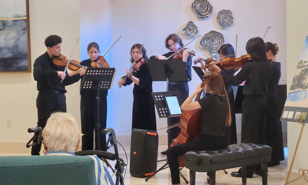Volunteer student musicians perform for residents at The Carlisle Palm Beach.